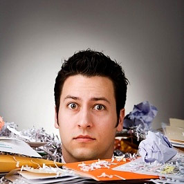 Man overwhelmed by paperwork